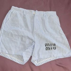 MIUMIU. Size Large. Blue and white striped shorts